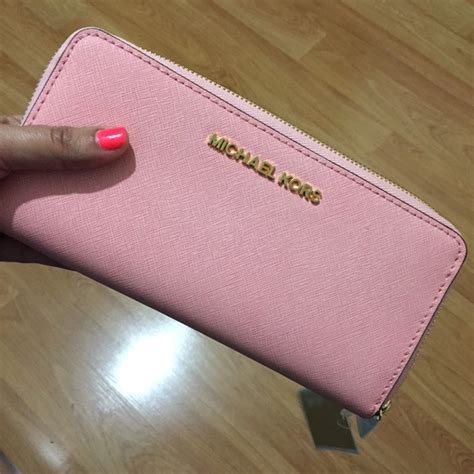 pink micheal kors wallet.